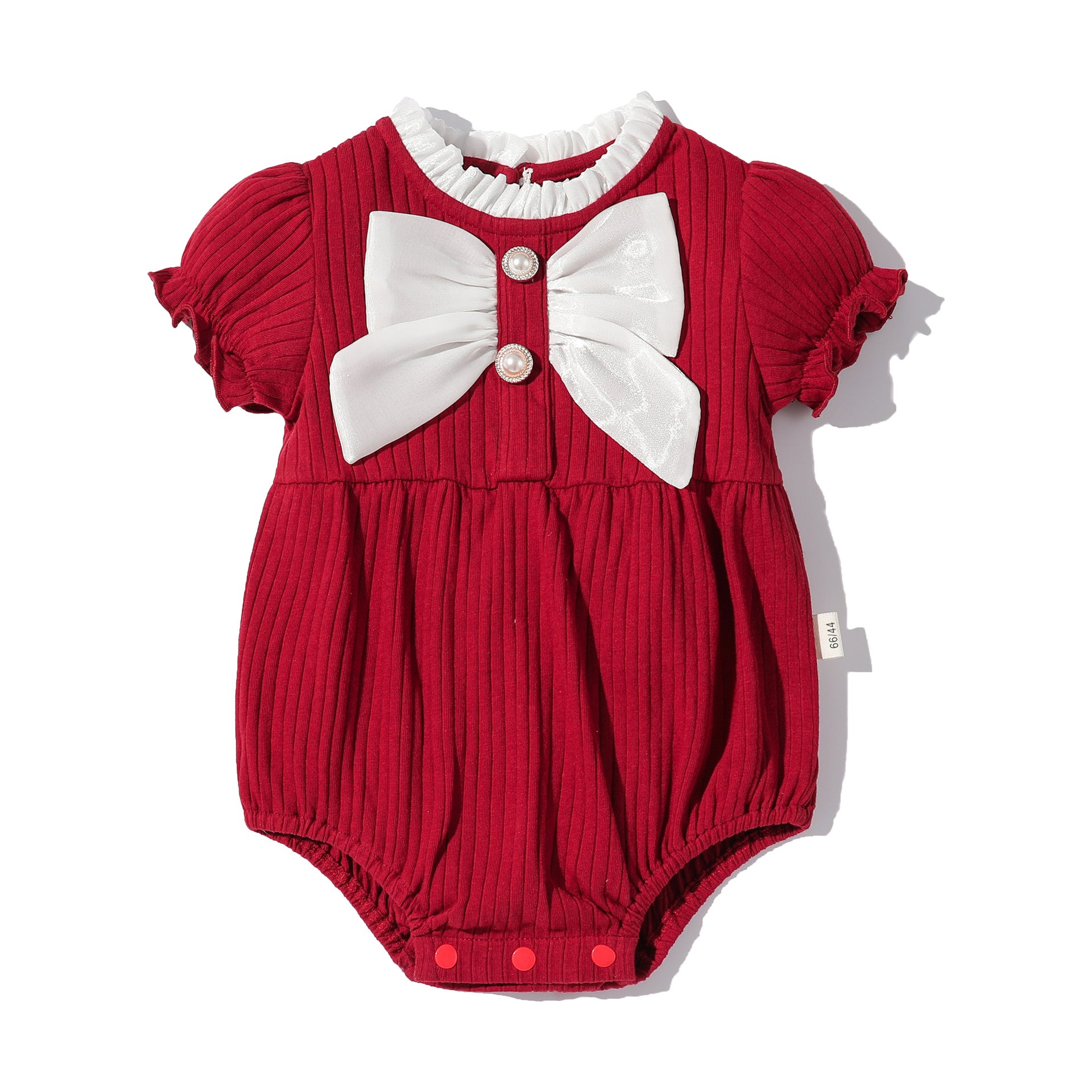 Baby girls solid color lace design puff-sleeved onesies in white, red, and pink, featuring a bow decoration.