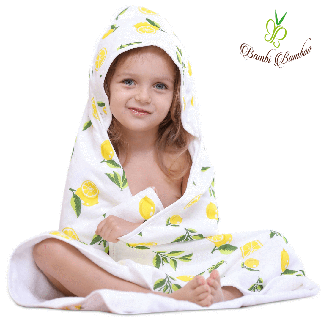 Baby hooded towel featuring a lemon print, made from buttery soft terry and muslin-backed organic bamboo, perfect for newborns to toddlers.