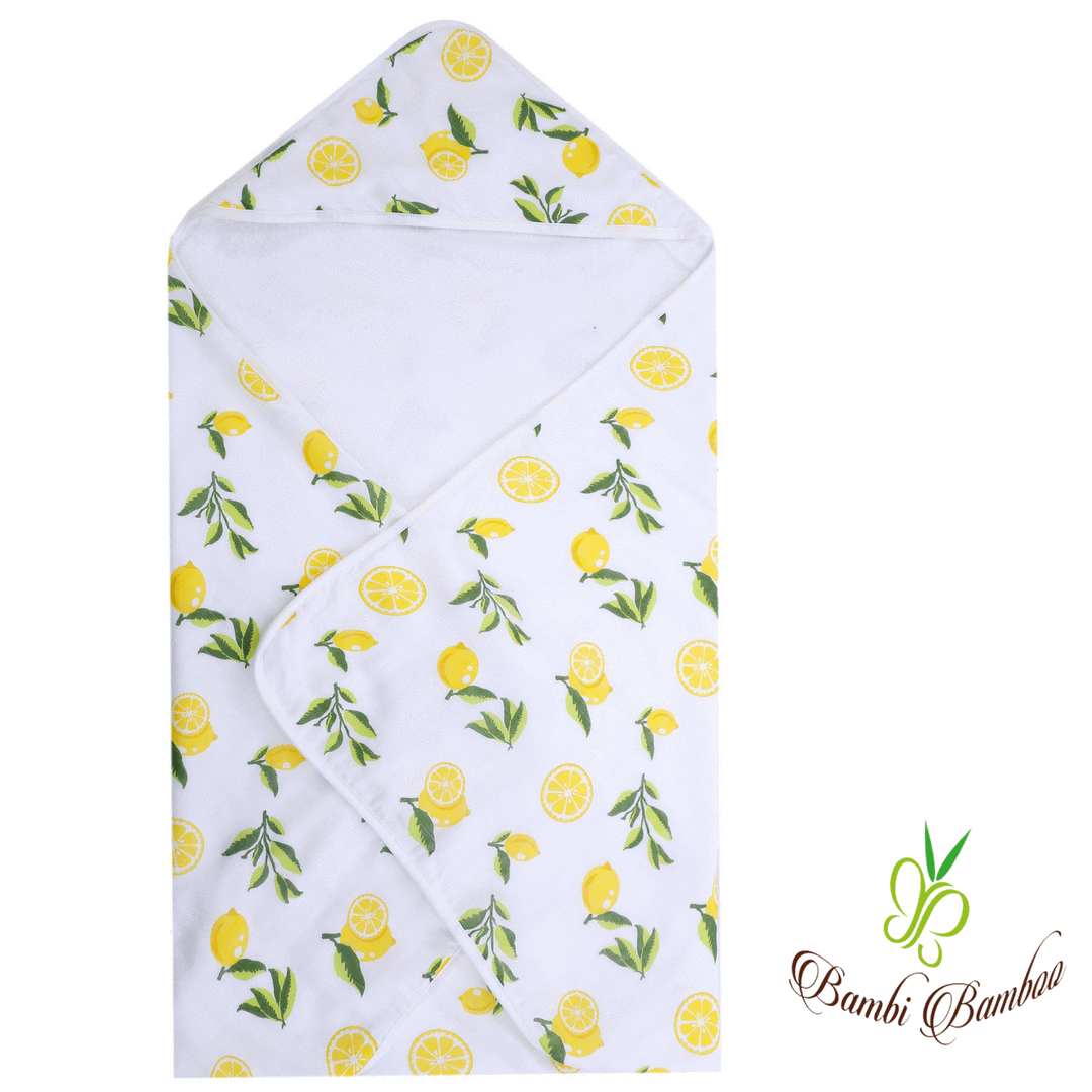 Baby hooded towel featuring a lemon print, made from buttery soft terry and muslin-backed organic bamboo, perfect for newborns to toddlers.