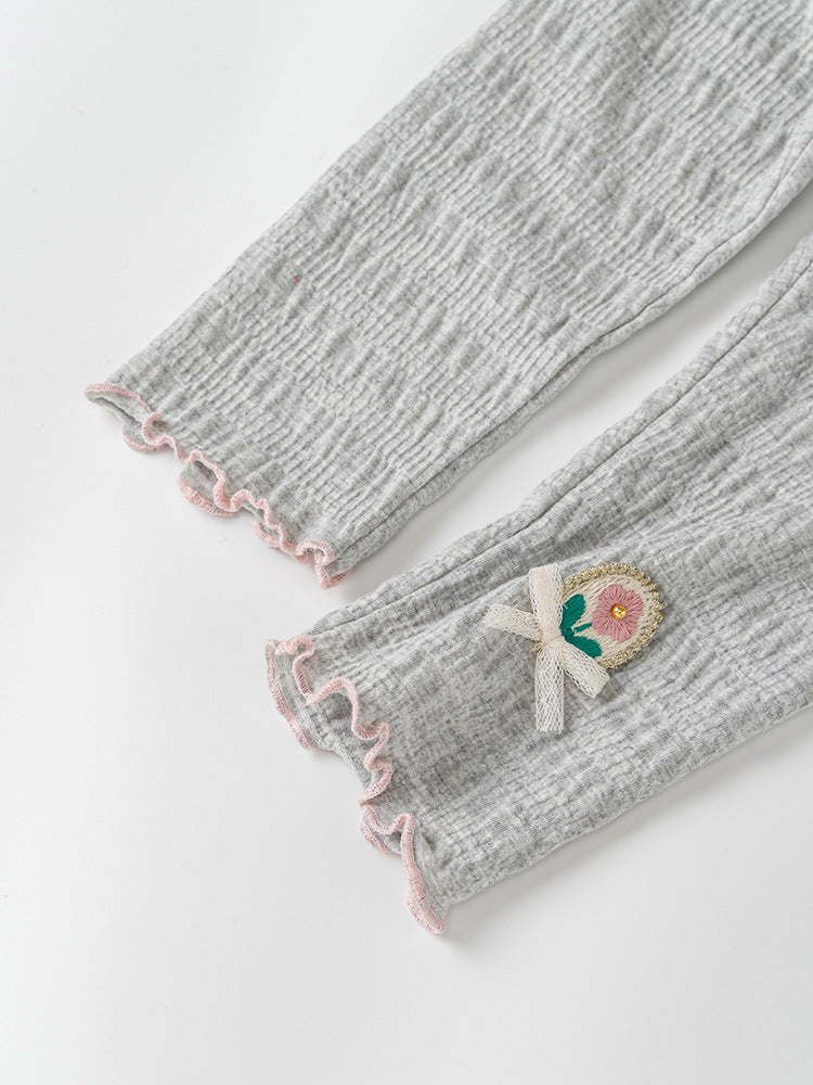 Baby girls' soft pants in grey and beige with embroidered flower logo, perfect for spring and autumn wear.