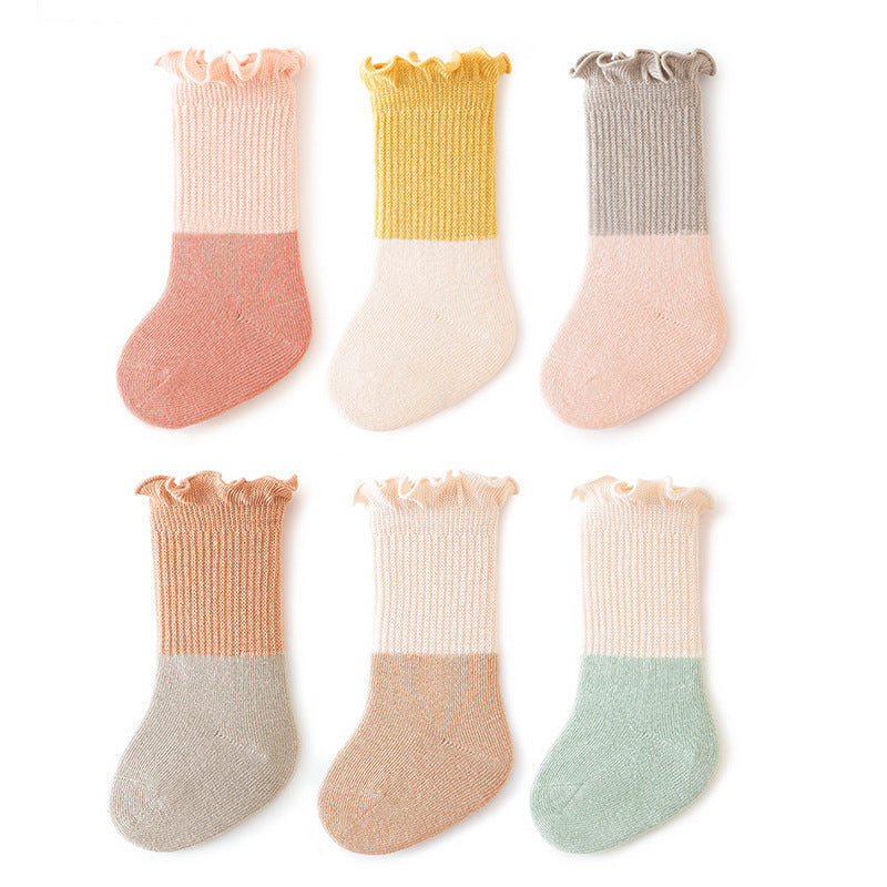 Colorful patchwork crew socks for babies and kids with ruffle fringe design, available in multiple colors.