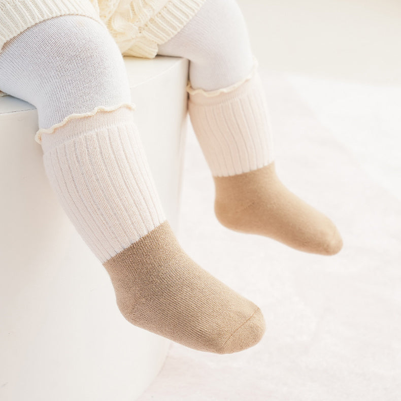 A variety of Baby Kids Unisex Patchwork Comfortable Mid-Calf Socks in multiple colors including white, pink, blue, green, yellow, beige, and brown.