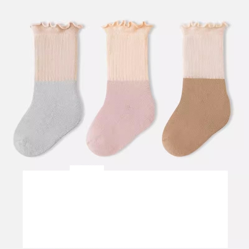 A variety of Baby Kids Unisex Patchwork Comfortable Mid-Calf Socks in multiple colors including white, pink, blue, green, yellow, beige, and brown.