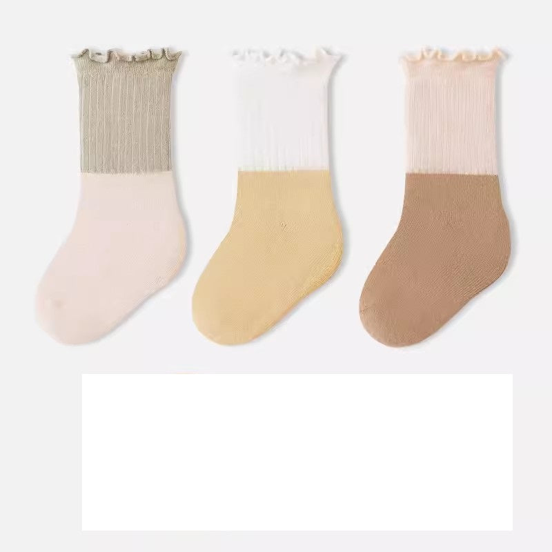 A variety of Baby Kids Unisex Patchwork Comfortable Mid-Calf Socks in multiple colors including white, pink, blue, green, yellow, beige, and brown.