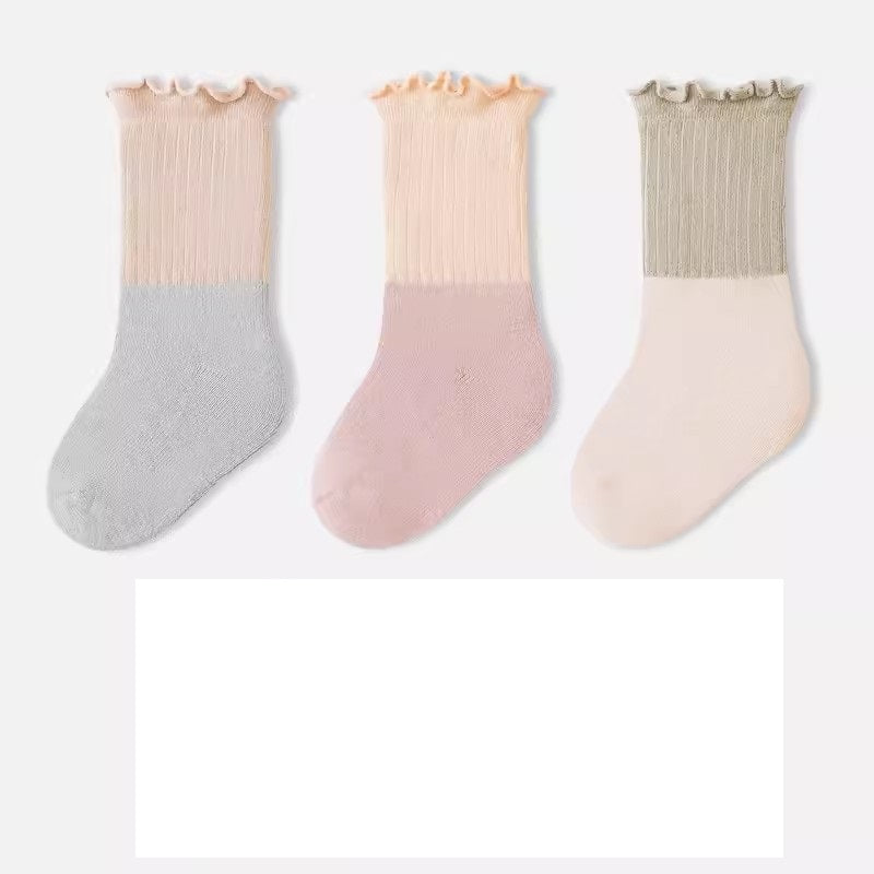 A variety of Baby Kids Unisex Patchwork Comfortable Mid-Calf Socks in multiple colors including white, pink, blue, green, yellow, beige, and brown.