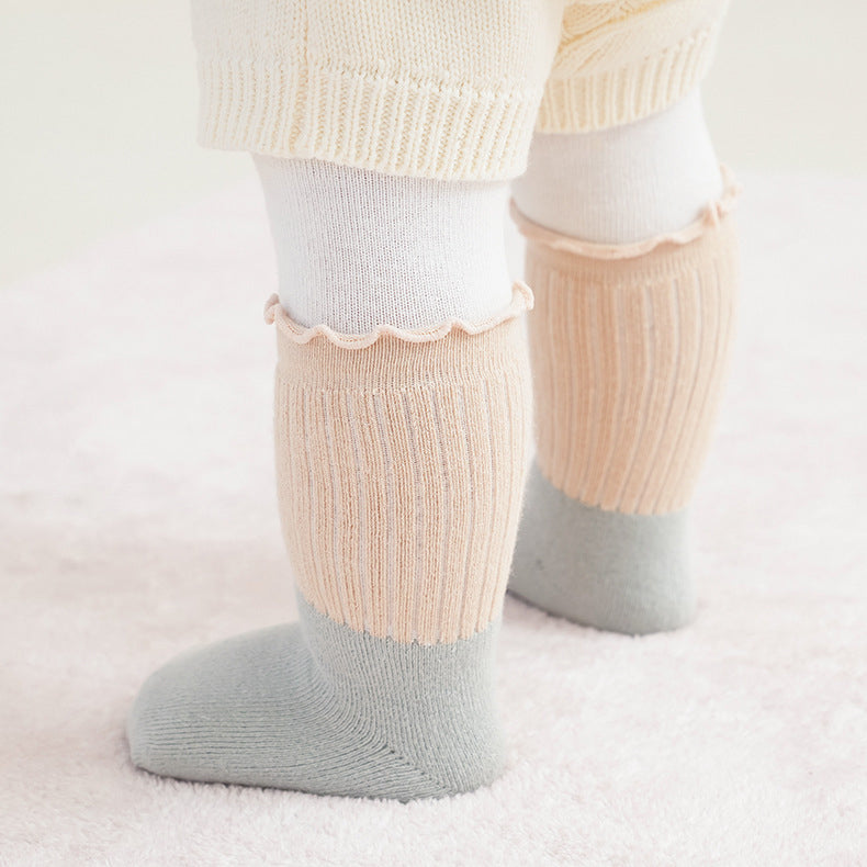 A variety of Baby Kids Unisex Patchwork Comfortable Mid-Calf Socks in multiple colors including white, pink, blue, green, yellow, beige, and brown.