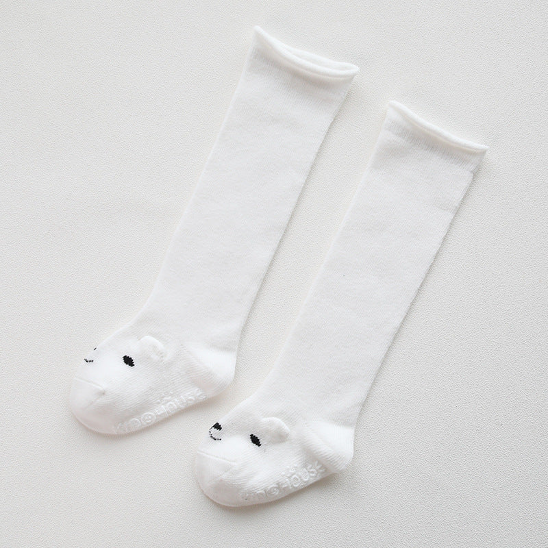 A pair of baby non-slip over the knee soft cotton high tube socks featuring cute animal and cartoon patterns, ideal for comfort and safety.