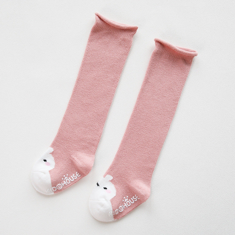 A pair of baby non-slip over the knee soft cotton high tube socks featuring cute animal and cartoon patterns, ideal for comfort and safety.