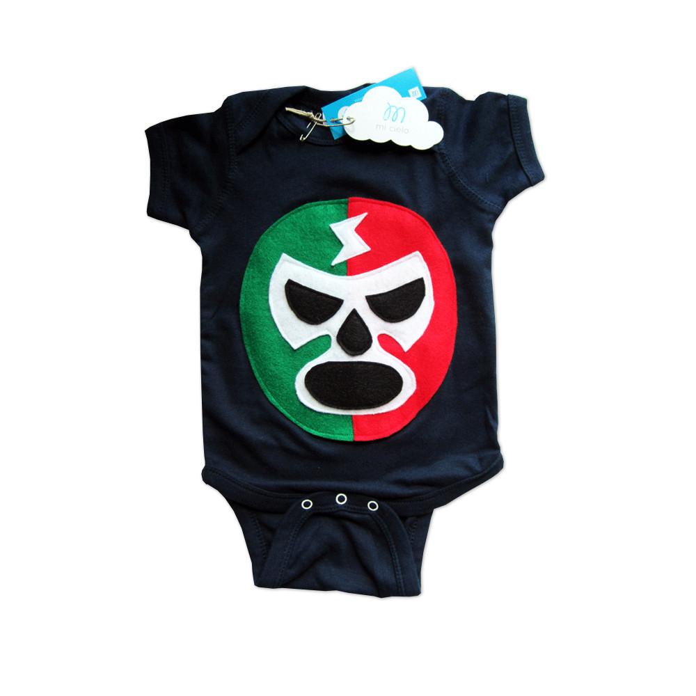 A vibrant baby onesie featuring a red and green luchador design, handmade with felt appliqués, perfect for infants.