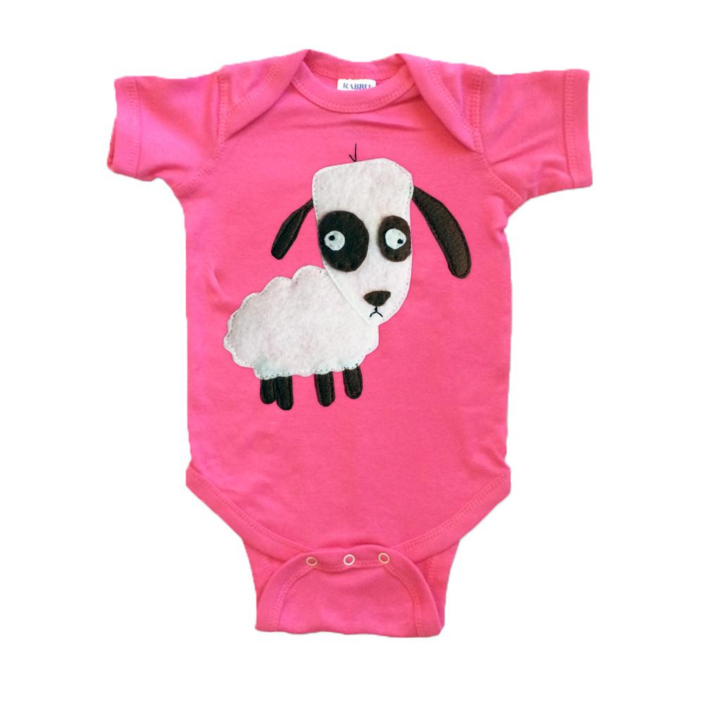 A vibrant raspberry baby onesie featuring a charming sheep design, handmade and hand-stitched, showcasing the collaboration between mi cielo and Matthew Langille.