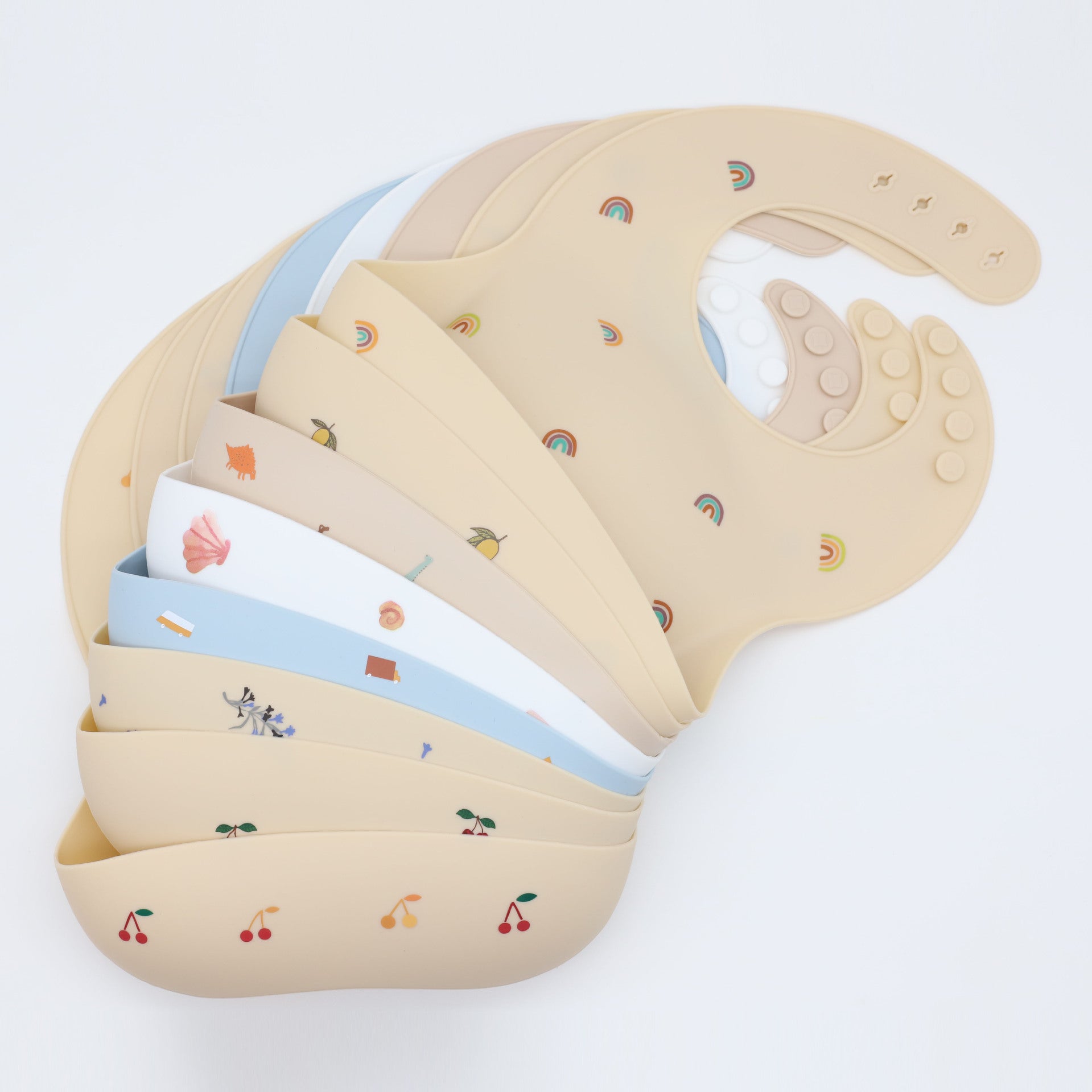 Colorful Baby Printed Pattern Food Grade Silicone Bibs displayed in various colors, showcasing their waterproof and lightweight design.