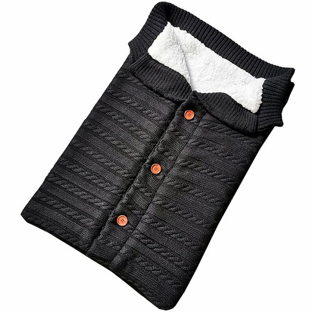 A cozy Baby Sleeping Bag Envelope in various colors, designed for infants, featuring a warm wool exterior and soft polar fleece lining.