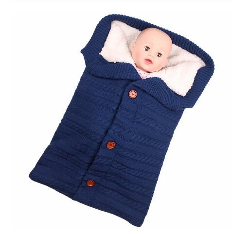 A cozy Baby Sleeping Bag Envelope in various colors, designed for infants, featuring a warm wool exterior and soft polar fleece lining.