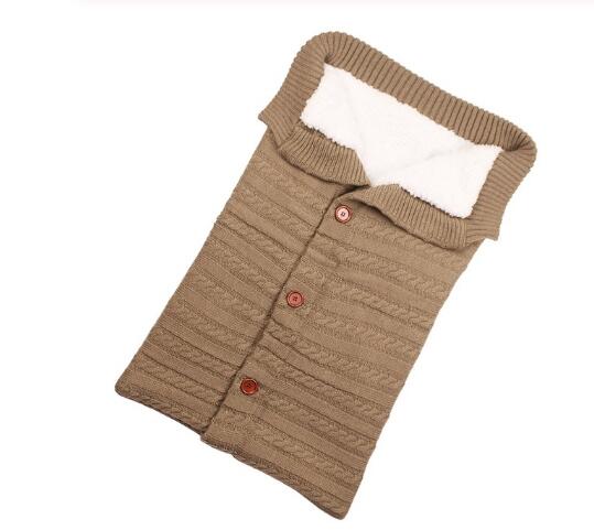 A cozy Baby Sleeping Bag Envelope in various colors, designed for infants, featuring a warm wool exterior and soft polar fleece lining.