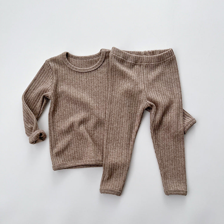 Baby solid color comfy fabric shirt sets in grey and apricot, perfect for lounging at home.