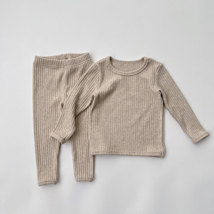 Baby solid color comfy fabric shirt sets in grey and apricot, perfect for lounging at home.