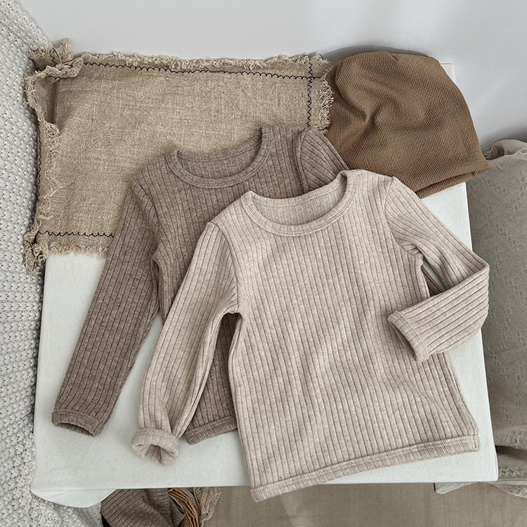 Baby solid color comfy fabric shirt sets in grey and apricot, perfect for lounging at home.