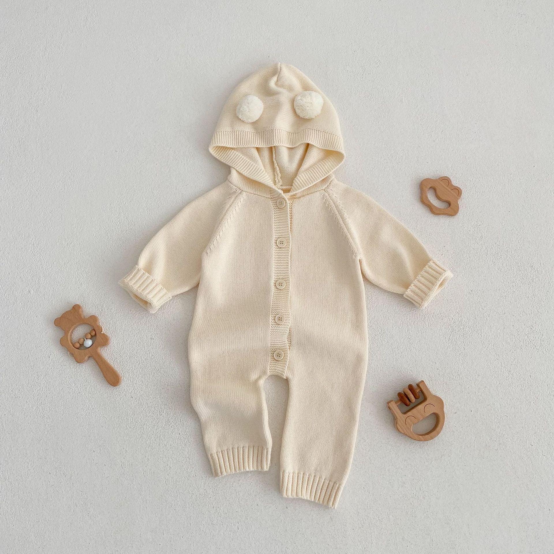 Baby Solid Color Full Button Design Knit Long Sleeve Jumpsuit in apricot color, suitable for both baby girls and boys.