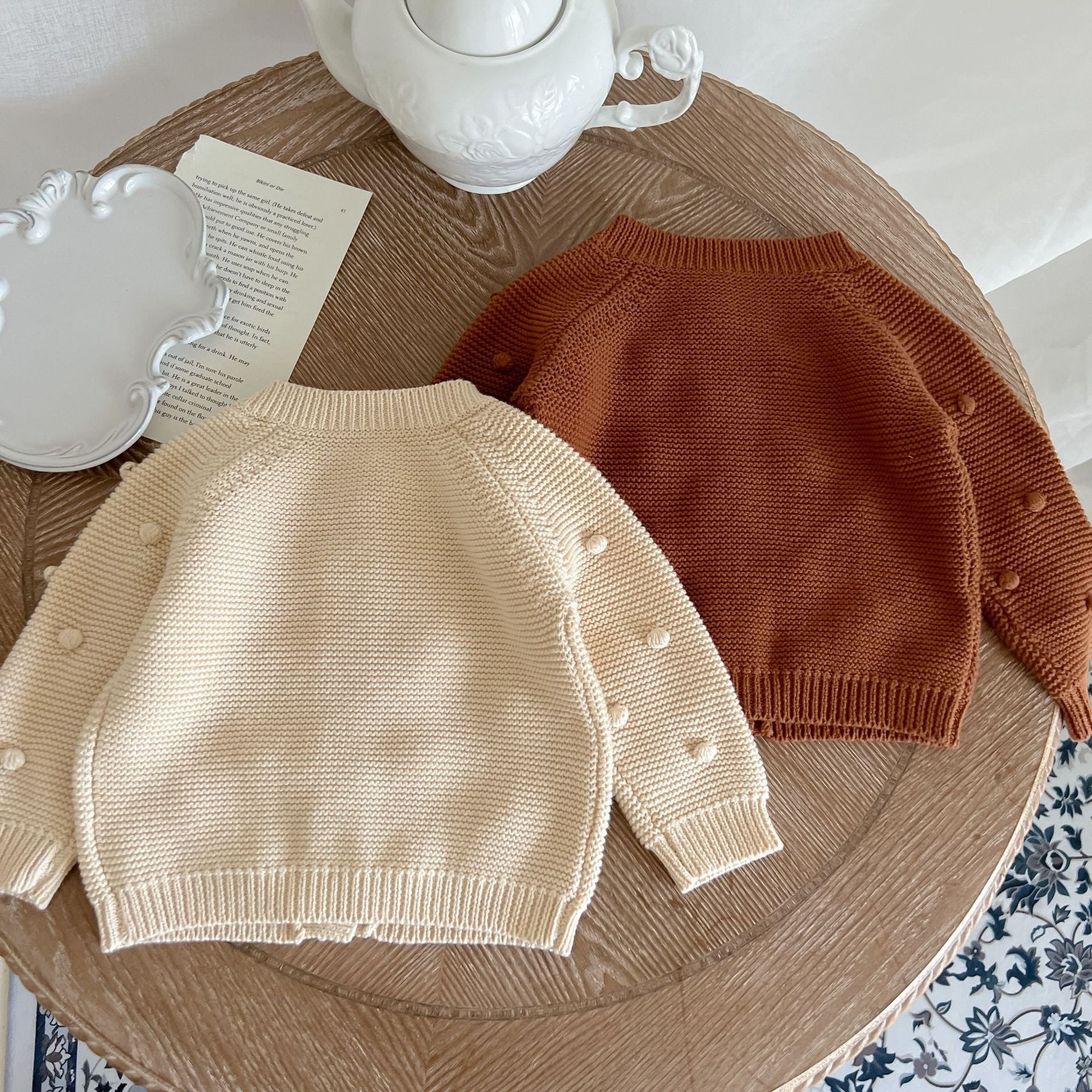 Baby Solid Color Cardigan with Fur-Ball Patches in apricot and brown, showcasing soft cotton material and stylish design.