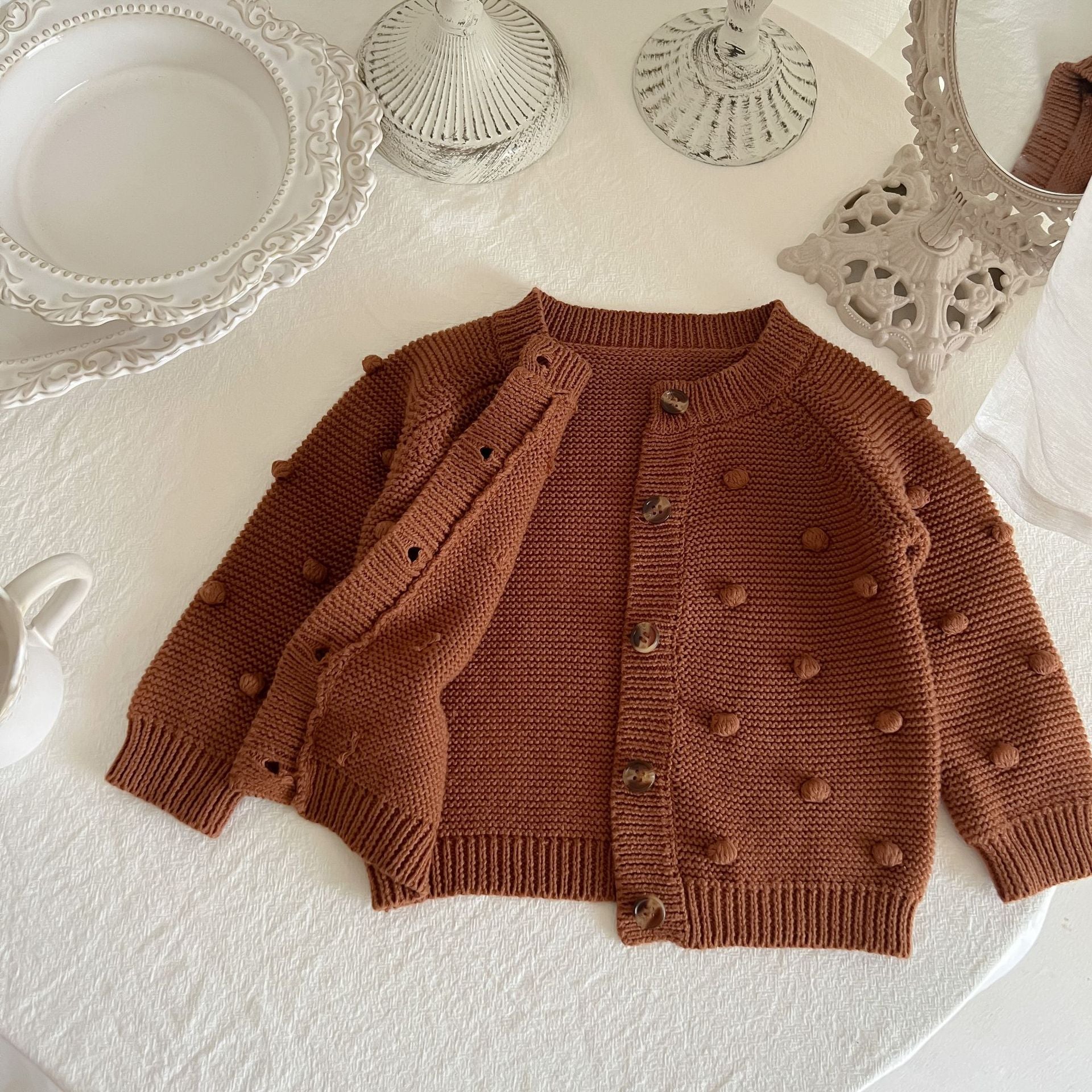 Baby Solid Color Cardigan with Fur-Ball Patches in apricot and brown, showcasing soft cotton material and stylish design.