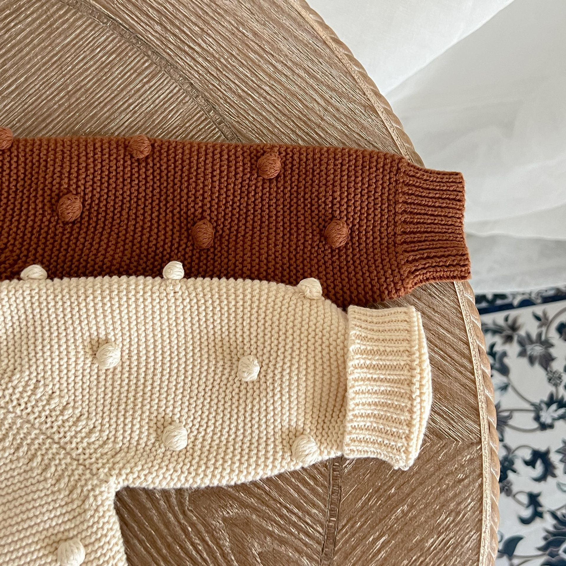 Baby Solid Color Cardigan with Fur-Ball Patches in apricot and brown, showcasing soft cotton material and stylish design.