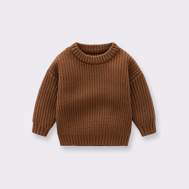 A cozy handknit baby pullover sweater in solid colors, perfect for boys and girls.