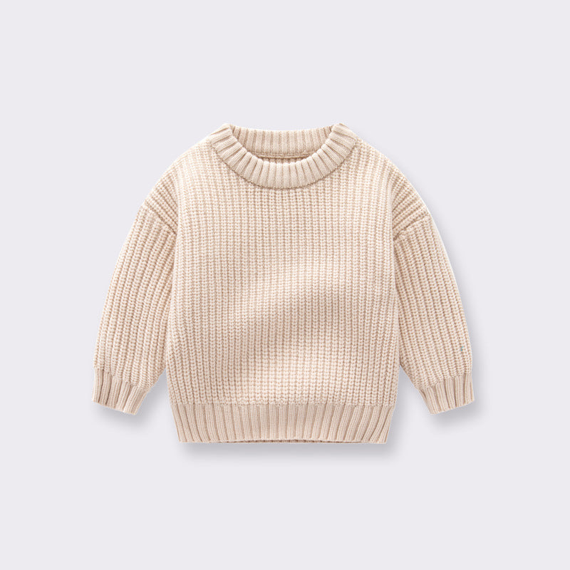 A cozy handknit baby pullover sweater in solid colors, perfect for boys and girls.