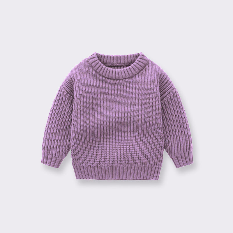 A cozy handknit baby pullover sweater in solid colors, perfect for boys and girls.