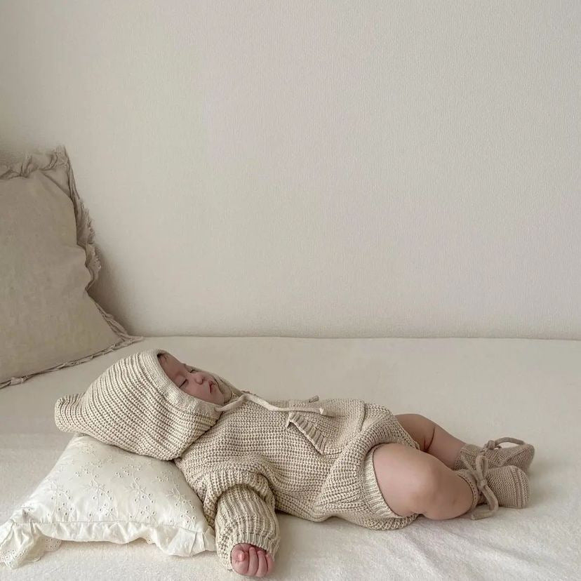 Baby Solid Color Knitted Hooded Triangle Onesie in apricot and brown, showcasing soft cotton fabric and stylish hood.