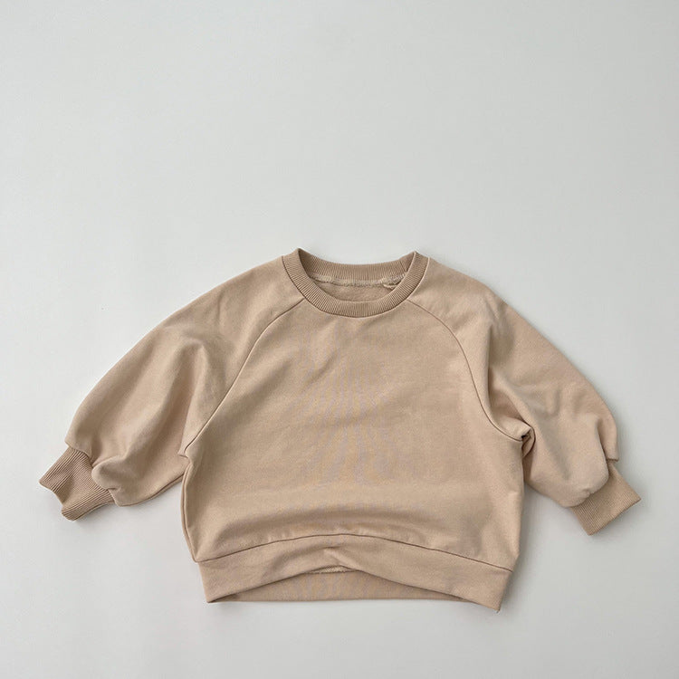 A collection of Baby Solid Color Long Sleeve Pullover Crewneck Hoodies in various colors including pink, green, and apricot, displayed neatly.