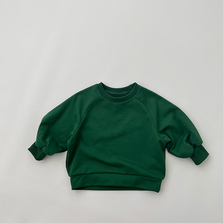 A collection of Baby Solid Color Long Sleeve Pullover Crewneck Hoodies in various colors including pink, green, and apricot, displayed neatly.