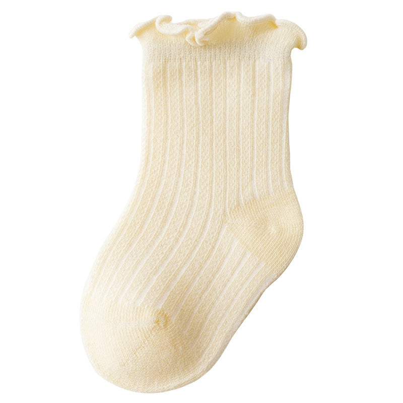 Adorable baby girl socks featuring a breathable mesh design and ruffle detail, perfect for special occasions.