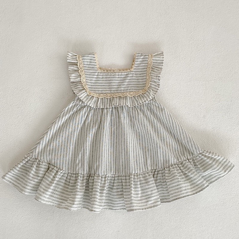 Baby girl wearing a striped sleeveless princess dress in green and light green, showcasing a playful summer style.