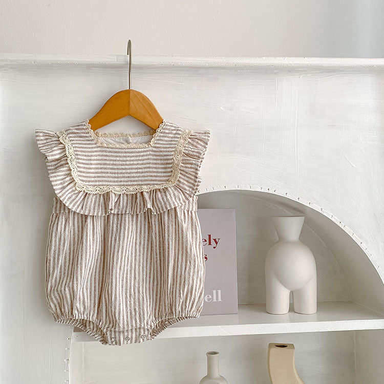 Baby girl wearing a striped sleeveless princess dress in green and light green, showcasing a playful summer style.