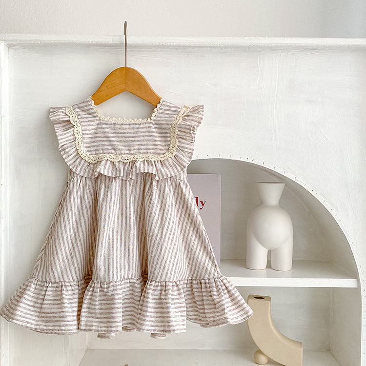 Baby girl wearing a striped sleeveless princess dress in green and light green, showcasing a playful summer style.