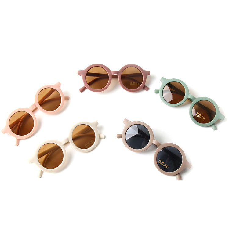 Colorful baby sunglasses designed for children aged 2-5 years, featuring lightweight frames and UV protection.