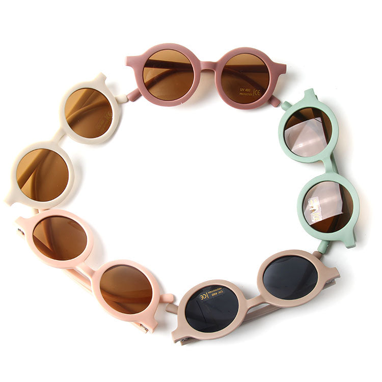 Colorful baby sunglasses designed for children aged 2-5 years, featuring lightweight frames and UV protection.