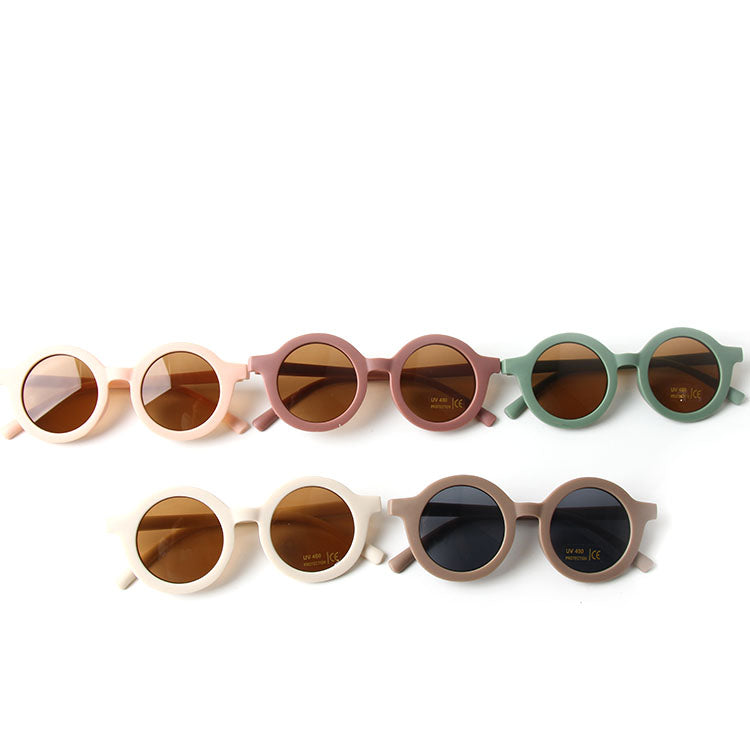 Colorful baby sunglasses designed for children aged 2-5 years, featuring lightweight frames and UV protection.