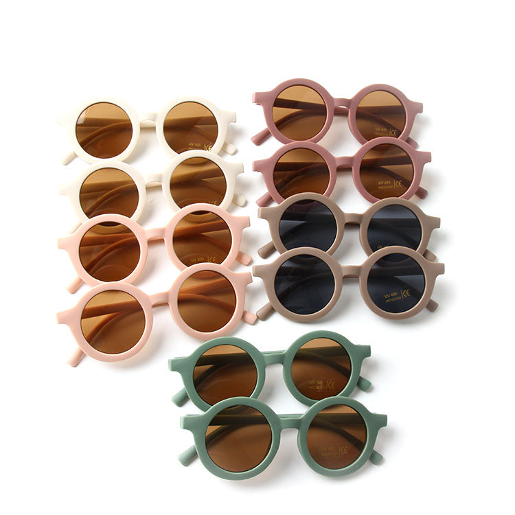 Colorful baby sunglasses designed for children aged 2-5 years, featuring lightweight frames and UV protection.