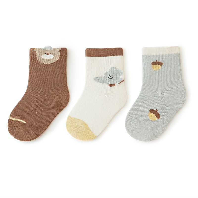 A colorful set of baby unisex cartoon socks in various colors including white, pink, light blue, apricot, and coffee, designed for comfort and style.