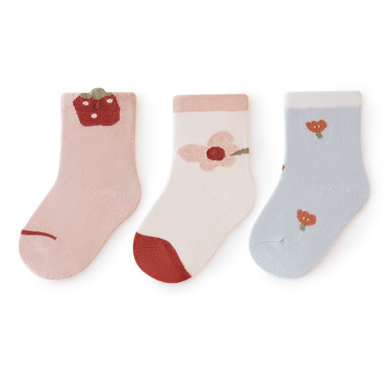 A colorful set of baby unisex cartoon socks in various colors including white, pink, light blue, apricot, and coffee, designed for comfort and style.