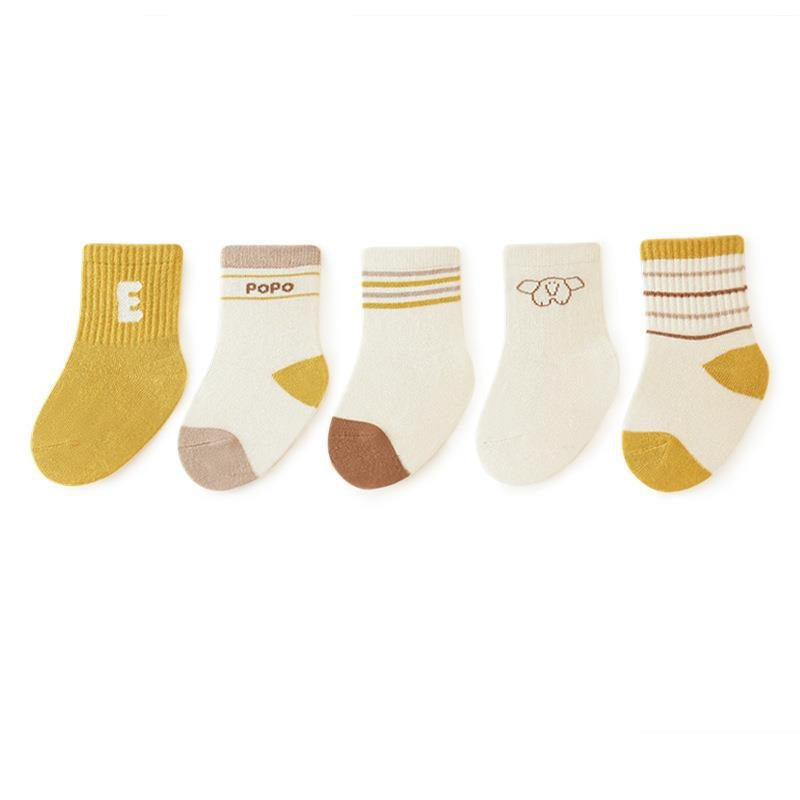 A colorful set of five pairs of baby socks in red, navy blue, blue, yellow, and grey, featuring fun patterns like stripes and cartoons.