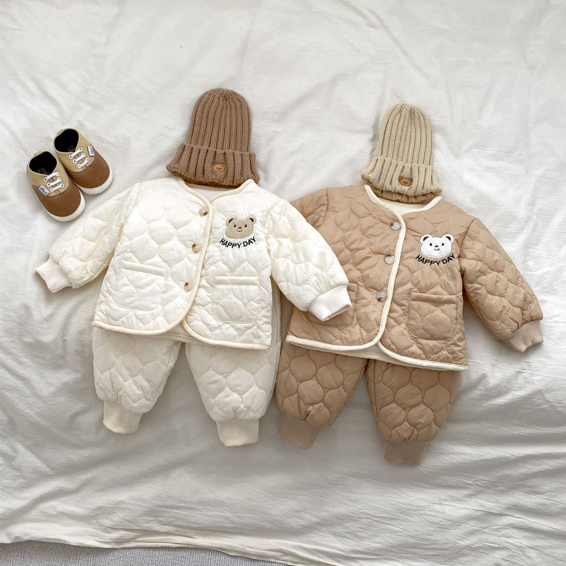 Baby unisex outfit featuring a thick warm long sleeve top with a bear head design and matching pants in white and khaki colors.