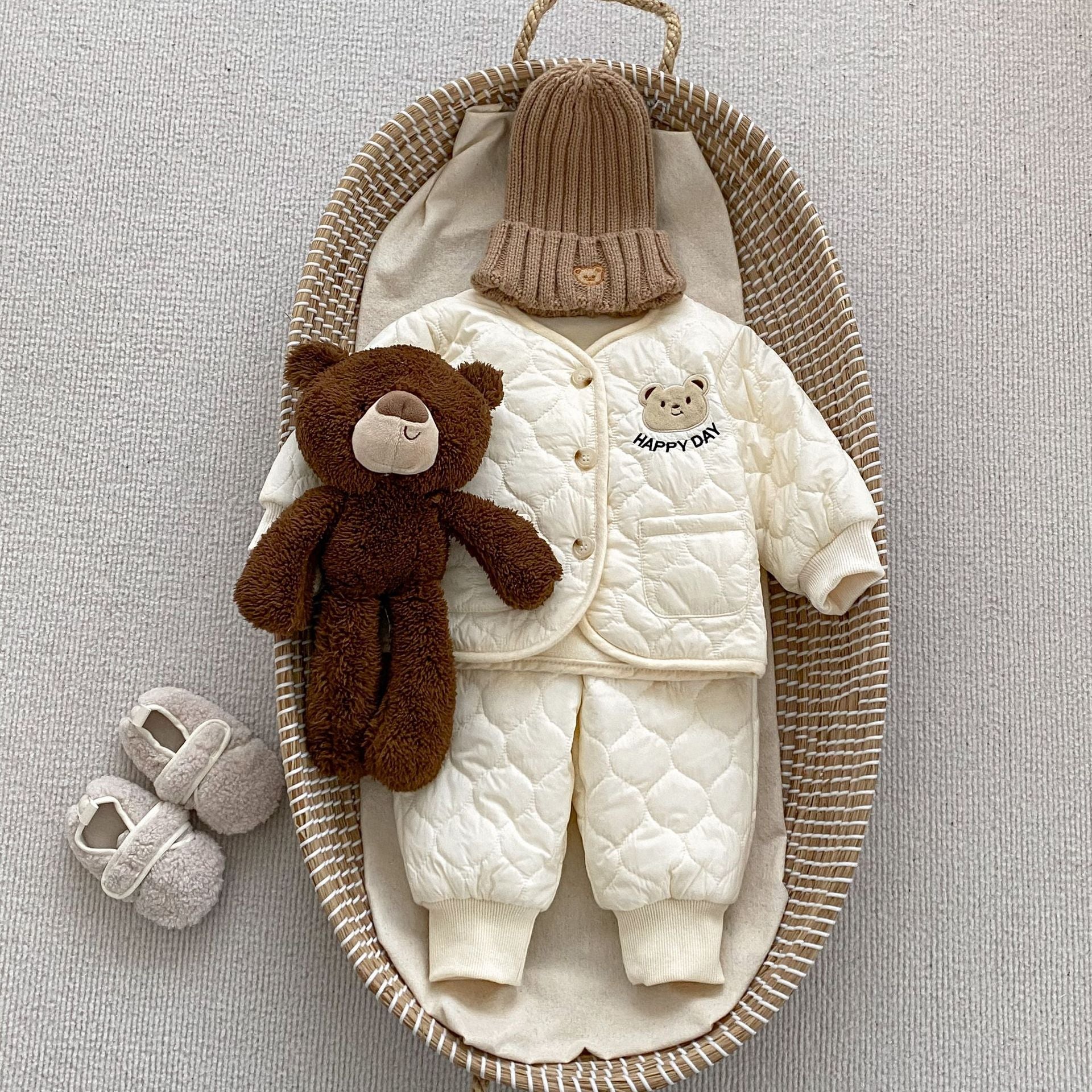 Baby unisex outfit featuring a thick warm long sleeve top with a bear head design and matching pants in white and khaki colors.