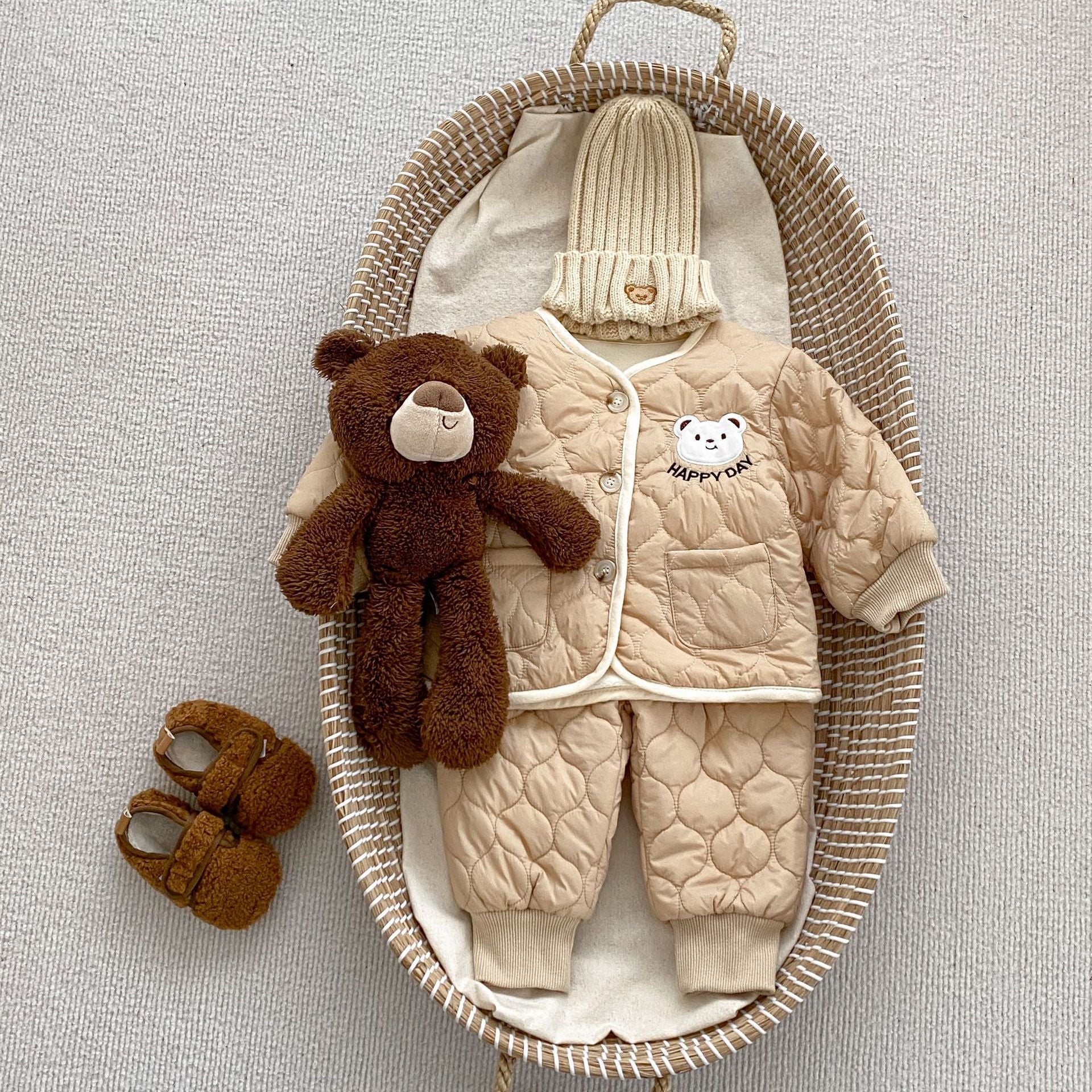 Baby unisex outfit featuring a thick warm long sleeve top with a bear head design and matching pants in white and khaki colors.