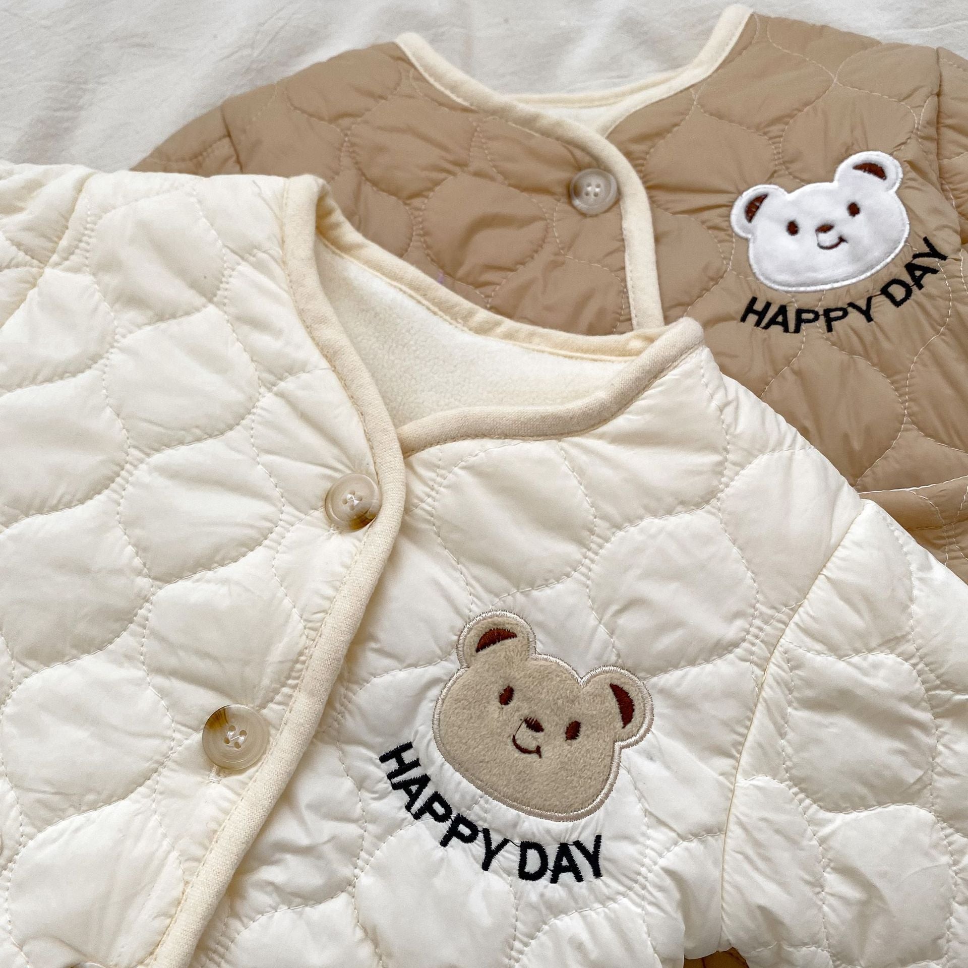 Baby unisex outfit featuring a thick warm long sleeve top with a bear head design and matching pants in white and khaki colors.