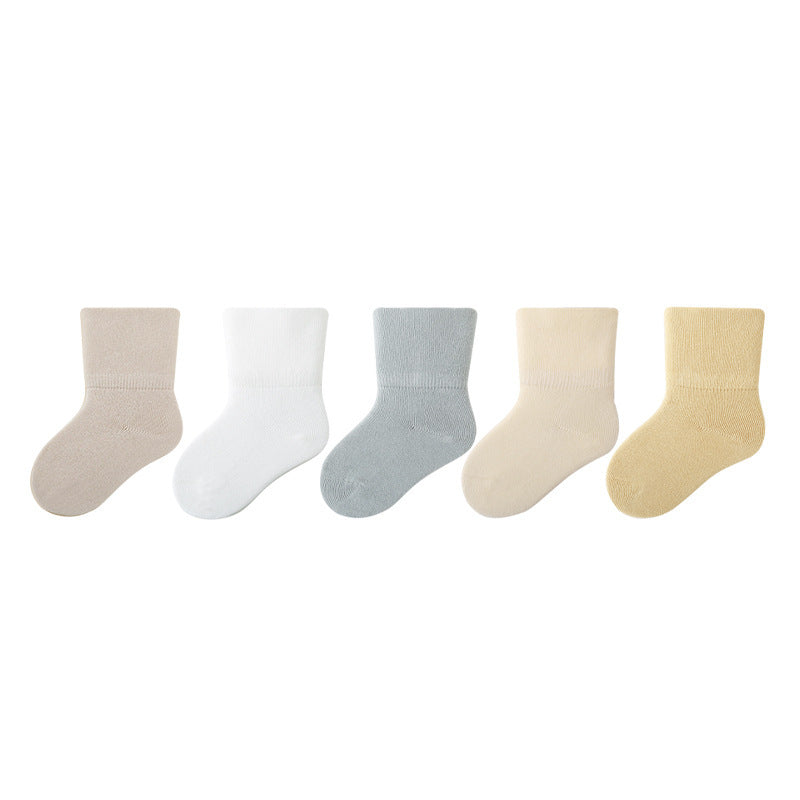 A pair of Baby Unisex Solid Color Breathable Mid-Calf Socks in various colors including white, grey, khaki, beige, and apricot, showcasing their soft fabric and mid-calf length.