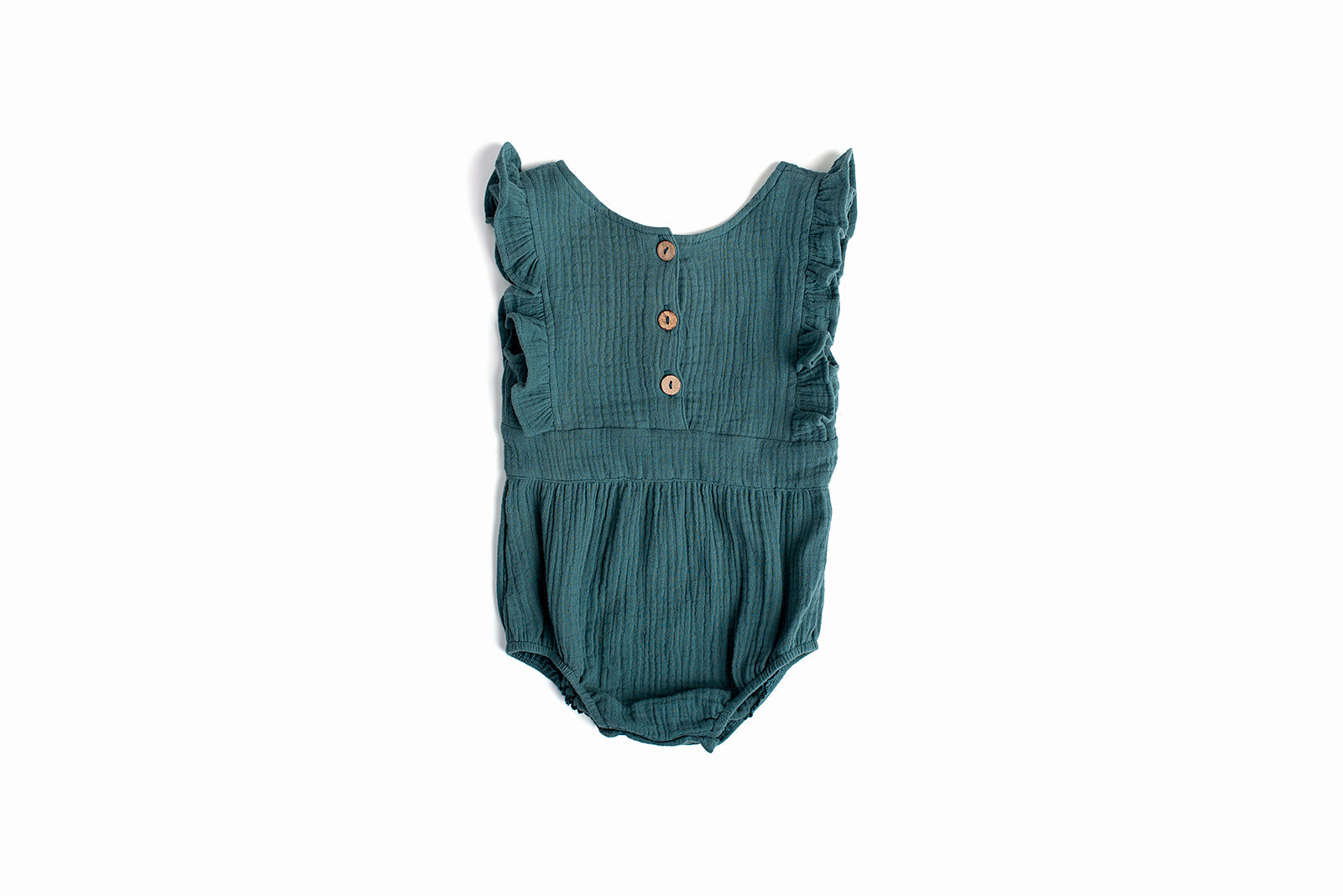 A stylish backless cotton romper for babies, featuring soft fabric and neutral colors, perfect for comfort and ease of wear.