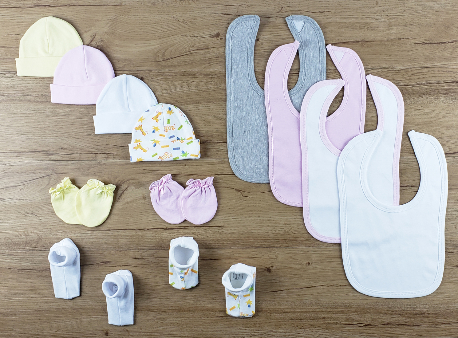 Bambini 13 PC set featuring soft cotton bibs, caps, and booties in various colors for newborns.