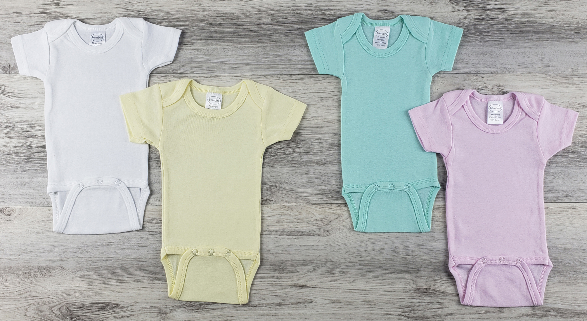 Bambini 4 Pc Layette Baby Clothes Set featuring soft cotton short sleeve onezies in yellow and pink, perfect for infants.